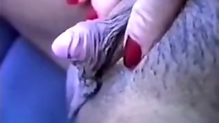 Rubbing and tickling her swollen big clit on camera