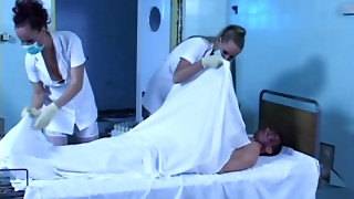 Two horny nurses get fucked by a zombie
